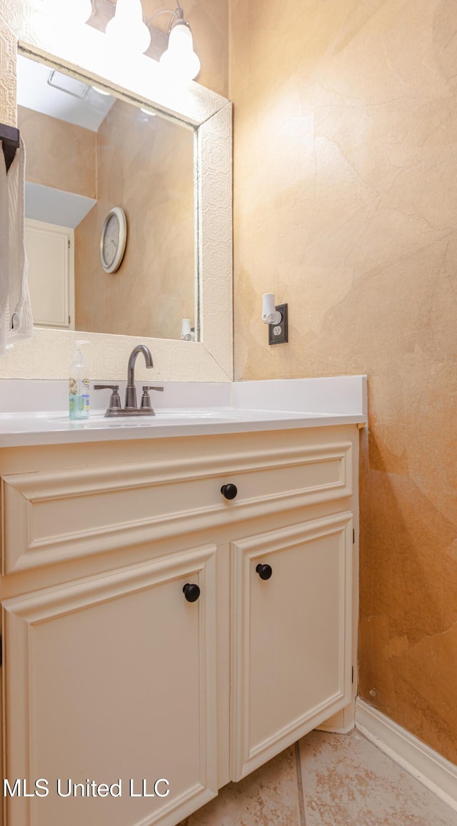 bathroom with tile patterned flooring and vanity