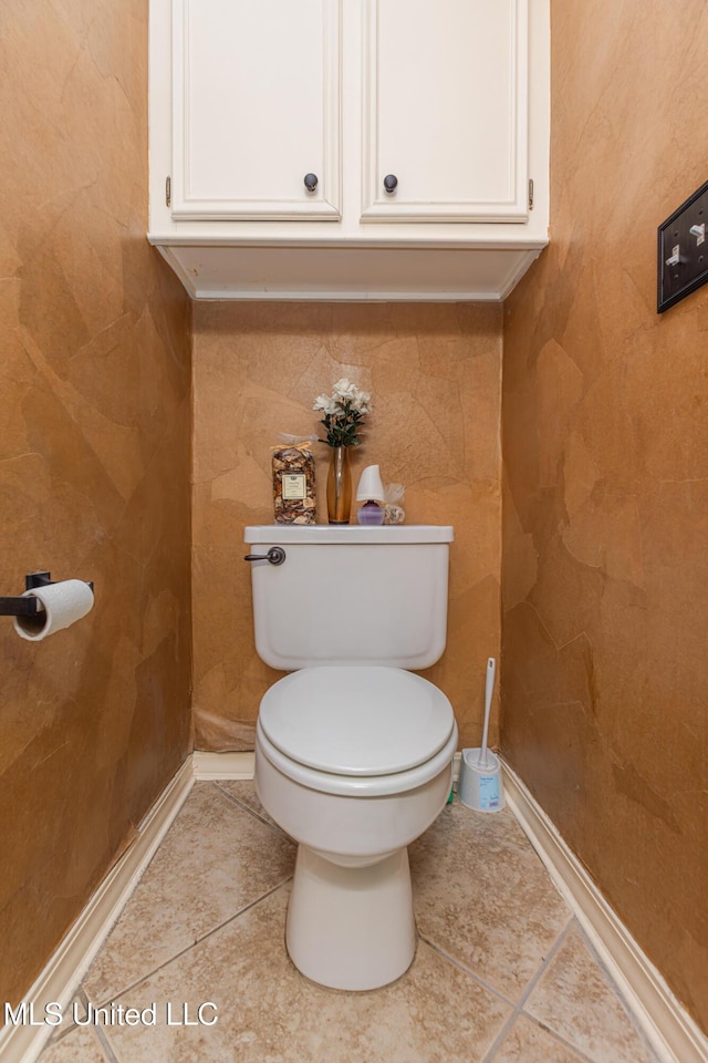 bathroom featuring tile patterned floors and toilet