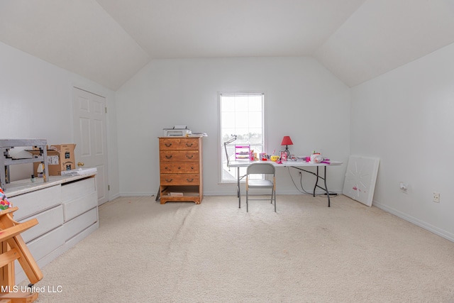 interior space featuring vaulted ceiling and light carpet