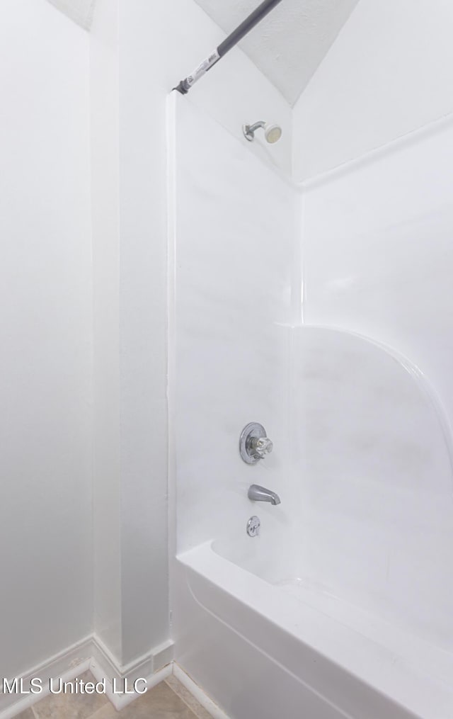 bathroom featuring  shower combination