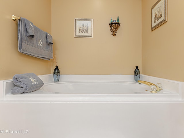 bathroom with a tub to relax in