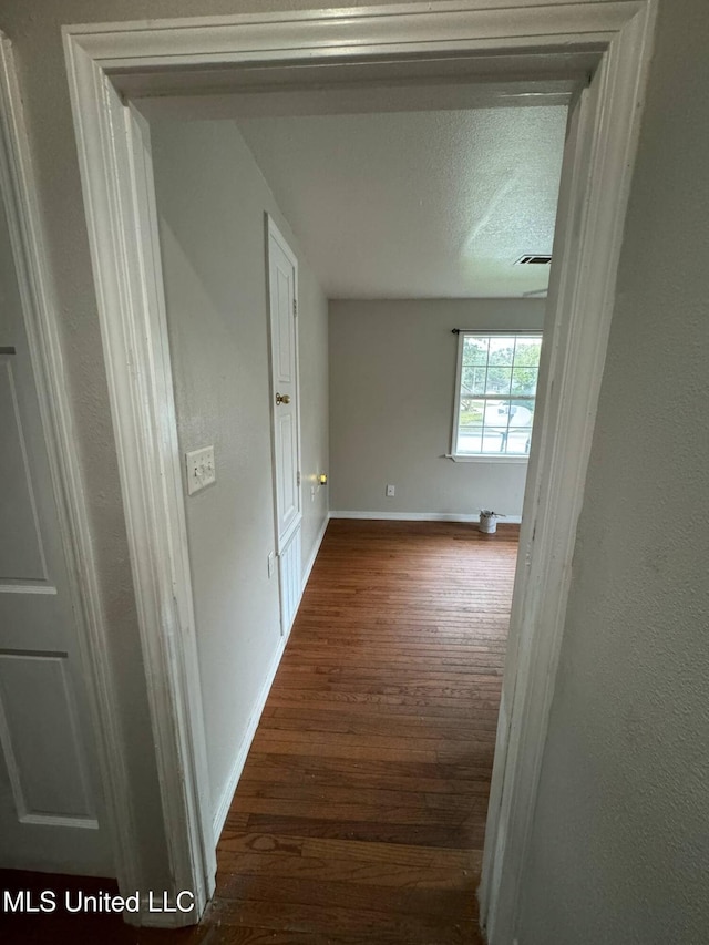 1607 Resca De La Palma St, Pascagoula, MS 39567 - corridor featuring dark wood-style flooring and baseboards