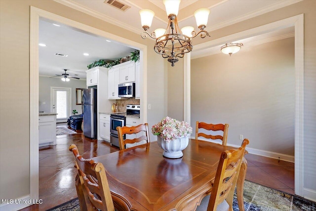 648 Westhill Rd, Brandon, MS 39042 - dining space featuring crown molding, a chandelier, a ceiling fan, and baseboards