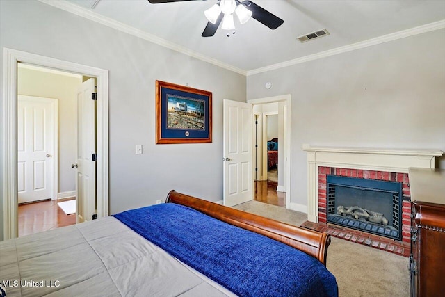 648 Westhill Rd, Brandon, MS 39042 - bedroom with crown molding, baseboards, a fireplace, and ceiling fan
