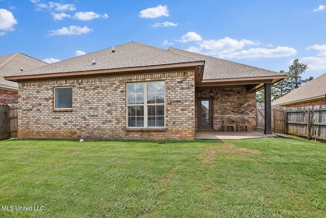 648 Westhill Rd, Brandon, MS 39042 - back of property with brick siding, a patio, and roof with shingles