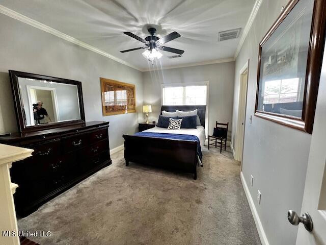 648 Westhill Rd, Brandon, MS 39042 - carpeted bedroom with baseboards, crown molding, and a ceiling fan