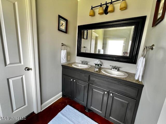 648 Westhill Rd, Brandon, MS 39042 - bathroom with double vanity and baseboards