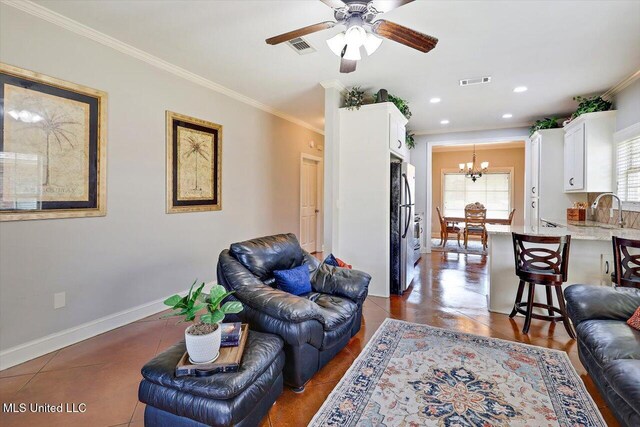 648 Westhill Rd, Brandon, MS 39042 - living room with a chandelier, ornamental molding, ceiling fan, baseboards, and recessed lighting