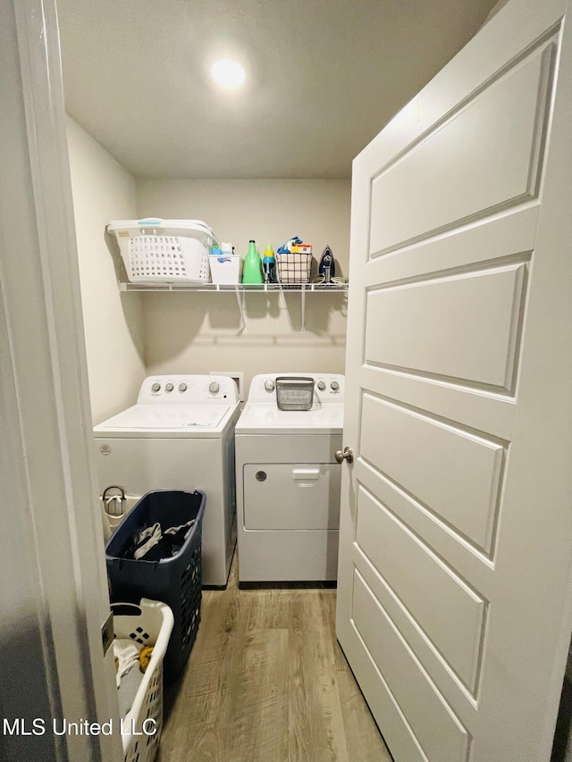 5438 Leeds Ln, Biloxi, MS 39532 - laundry room featuring laundry area, light wood-style flooring, and independent washer and dryer