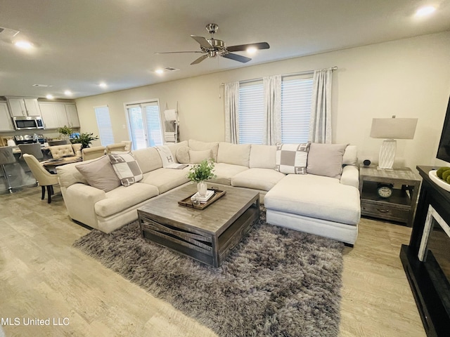 5438 Leeds Ln, Biloxi, MS 39532 - living room featuring light wood-style floors, ceiling fan, and recessed lighting