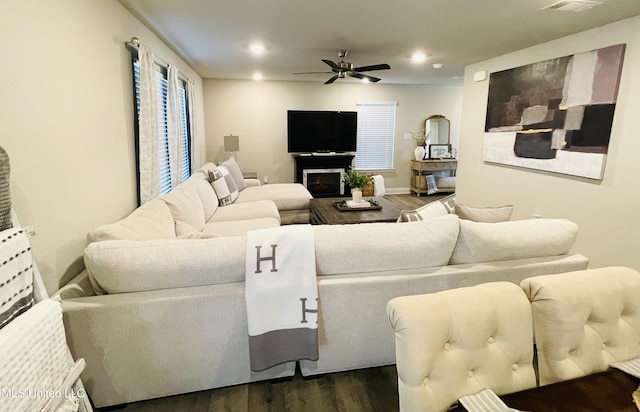 5438 Leeds Ln, Biloxi, MS 39532 - living area featuring a fireplace, a ceiling fan, recessed lighting, and dark wood-type flooring