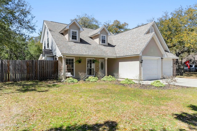 view of front of house featuring fence, a front yard, stucco siding, a garage, and driveway