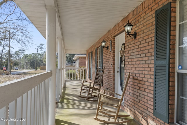 wooden terrace with a porch