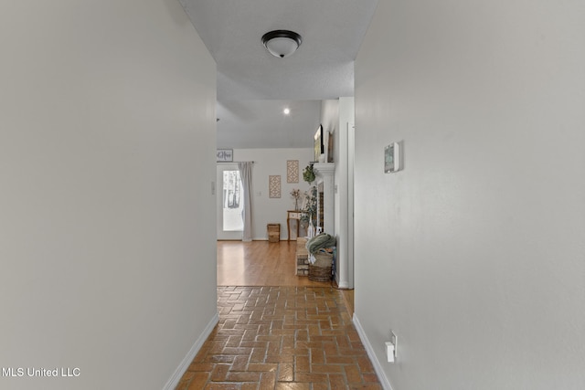 corridor with a textured ceiling