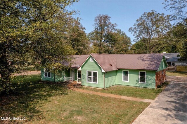 250 1st St, Webb, MS 38966 - ranch-style house featuring a front yard and metal roof