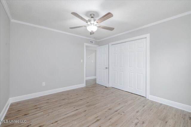 250 1st St, Webb, MS 38966 - unfurnished bedroom with wood finished floors, a closet, baseboards, a ceiling fan, and ornamental molding