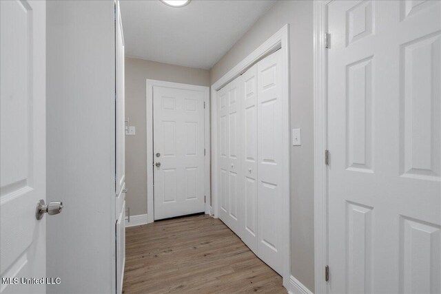 250 1st St, Webb, MS 38966 - hall featuring light wood finished floors and baseboards