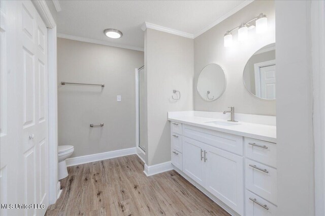 250 1st St, Webb, MS 38966 - full bathroom featuring wood finished floors, vanity, toilet, a shower stall, and baseboards