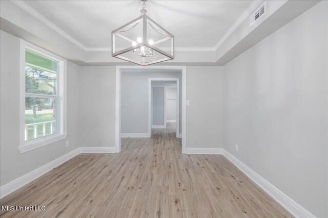 250 1st St, Webb, MS 38966 - unfurnished room with a chandelier, wood finished floors, a tray ceiling, baseboards, and ornamental molding