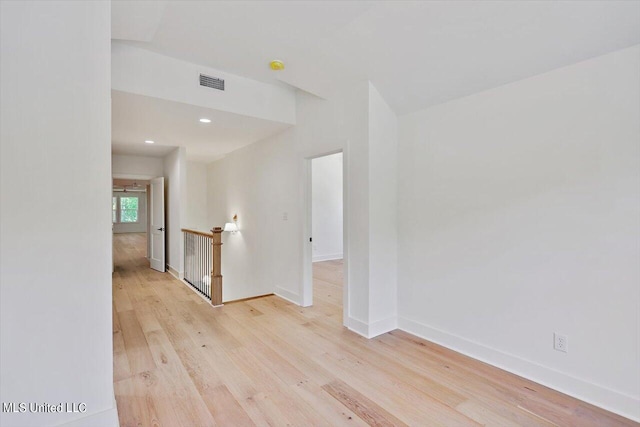 unfurnished room with light hardwood / wood-style flooring