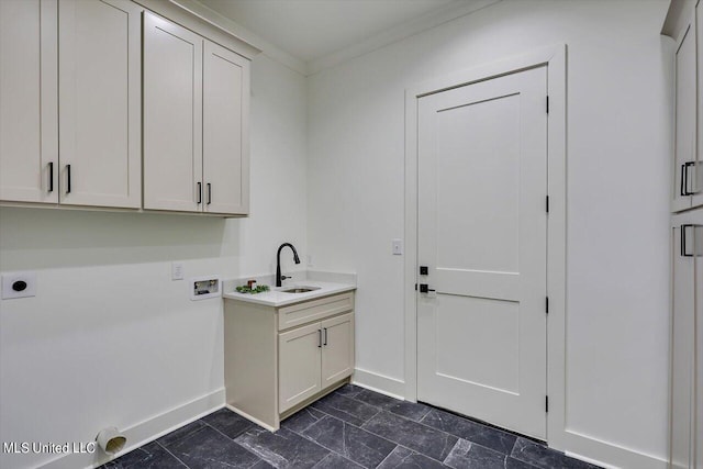 laundry room featuring cabinets, washer hookup, ornamental molding, electric dryer hookup, and sink