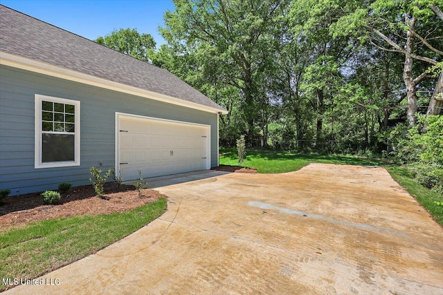 garage with a lawn