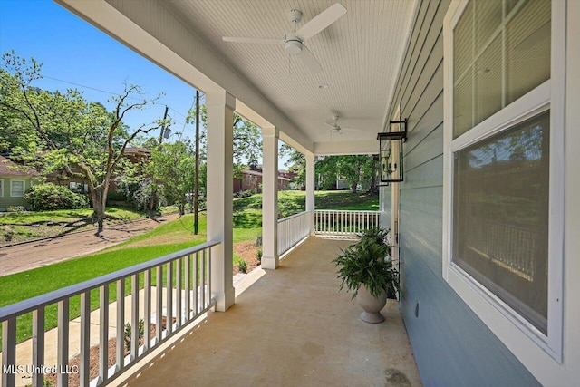 view of patio featuring ceiling fan and a porch