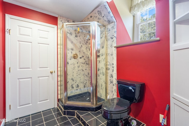 bathroom with toilet, walk in shower, and tile patterned flooring