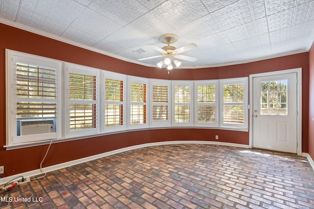 unfurnished sunroom featuring cooling unit and ceiling fan