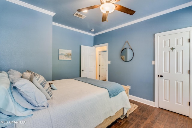 bedroom featuring ceiling fan, dark hardwood / wood-style flooring, and ornamental molding