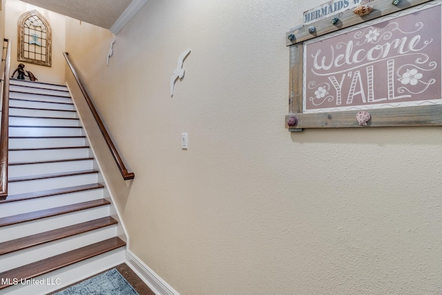 staircase with ornamental molding