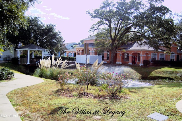 view of property's community featuring a gazebo and a yard