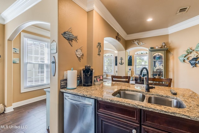 kitchen with dishwasher, dark hardwood / wood-style floors, sink, and a wealth of natural light