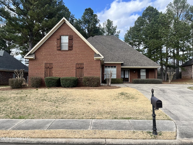 view of front property with a garage and a front yard