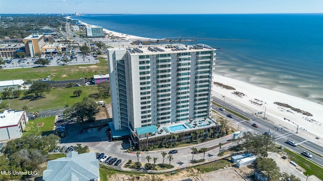 birds eye view of property featuring a water view and a city view