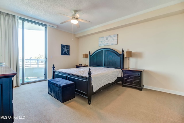 bedroom featuring a textured ceiling, ceiling fan, light colored carpet, baseboards, and access to outside