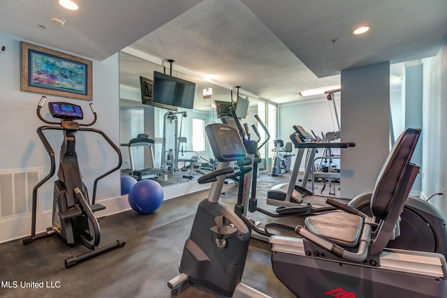 workout area featuring visible vents and recessed lighting