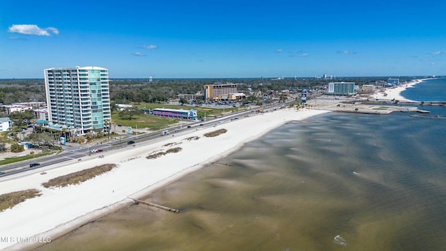 aerial view featuring a water view, a view of city, and a view of the beach