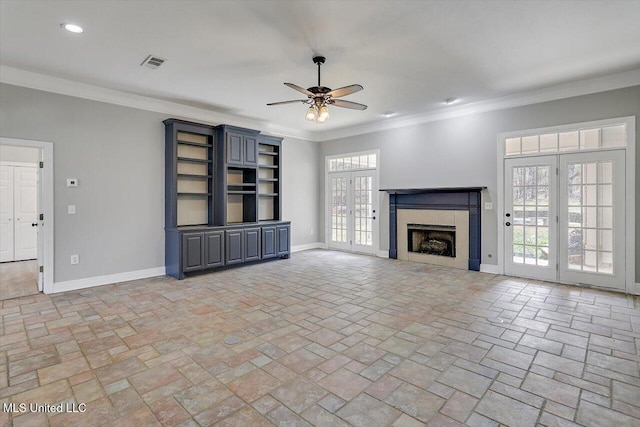 unfurnished living room with crown molding, visible vents, and baseboards