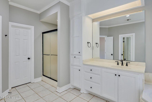 full bathroom with a shower stall, vanity, ornamental molding, and tile patterned floors