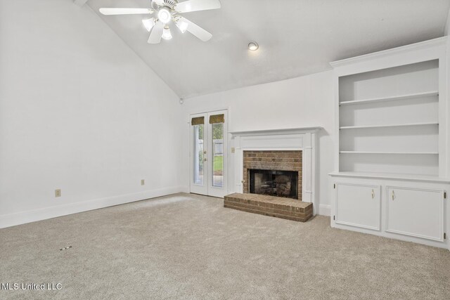 1035 N Azalea Dr, Madison, MS 39110 - unfurnished living room with a ceiling fan, carpet flooring, baseboards, a brick fireplace, and high vaulted ceiling