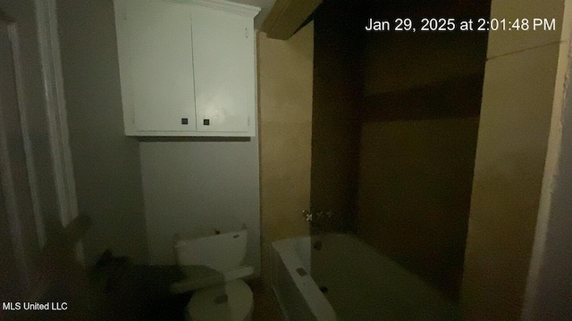 bathroom with toilet and a bathing tub