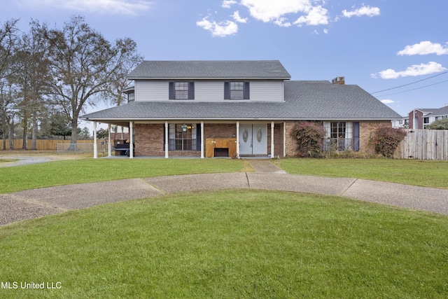 view of front facade featuring covered porch and a front lawn