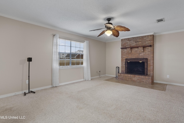 unfurnished living room featuring ornamental molding, light carpet, a fireplace, and a textured ceiling