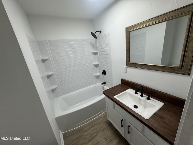 bathroom featuring vanity, shower / tub combination, and wood finished floors