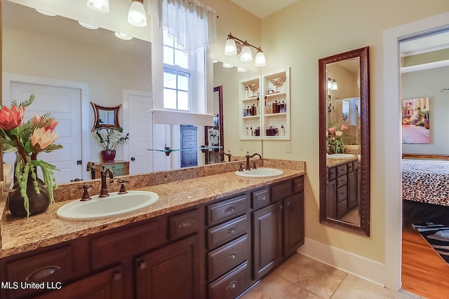 bathroom with vanity and wood-type flooring