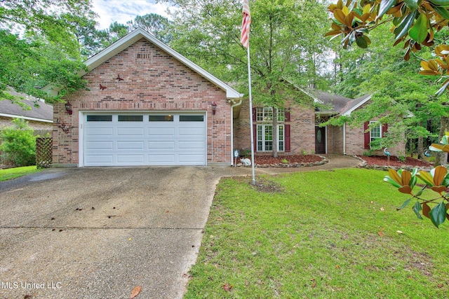 8314 Kahala Dr, Diamondhead, MS 39525 - view of front of home featuring driveway, brick siding, a garage, and a front yard