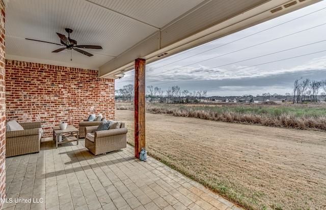 view of patio featuring ceiling fan