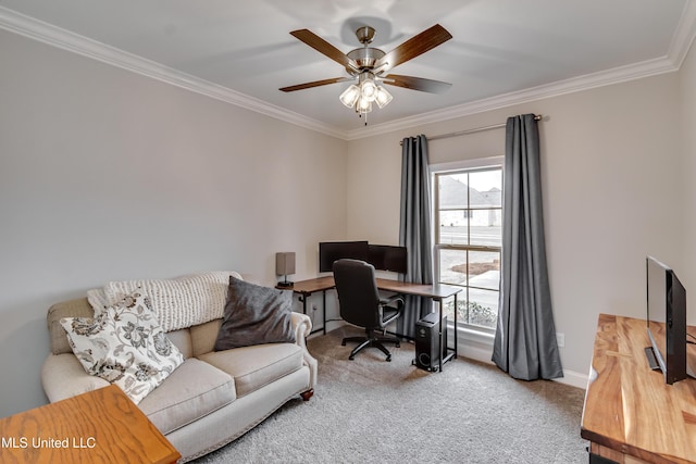 carpeted home office featuring baseboards, a ceiling fan, and crown molding