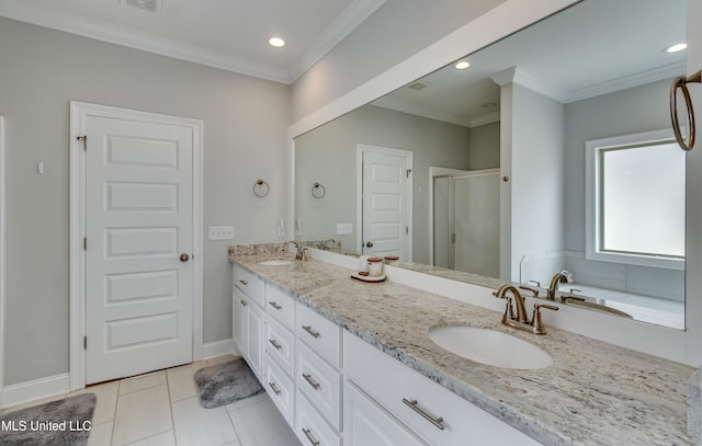 full bath featuring double vanity, a sink, and crown molding